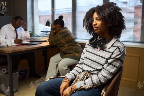 Preview: Teenage Black Girl Waiting While School Principal Meeting with Parent
