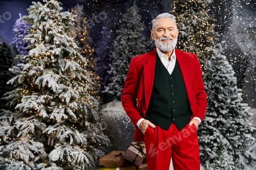 Preview: A festive figure in a red suit stands amongst snowy Christmas trees and shimmering lights