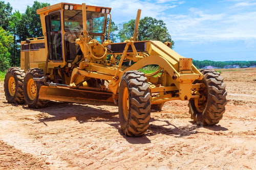 Preview: At construction site, a heavy earthmoving construction grader tractor is in use