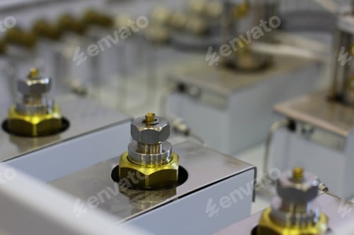 Preview: Close-up of Golden Metal Parts on Machinery