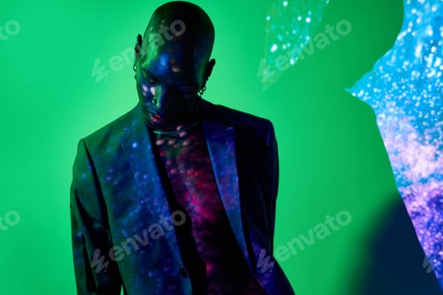 Preview: Trendy black man in dark studio
