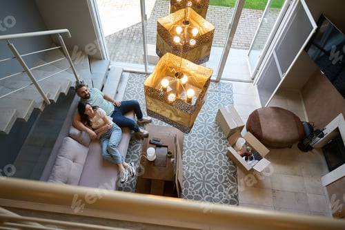 Aperçu: Couple in love spending time together in modern room