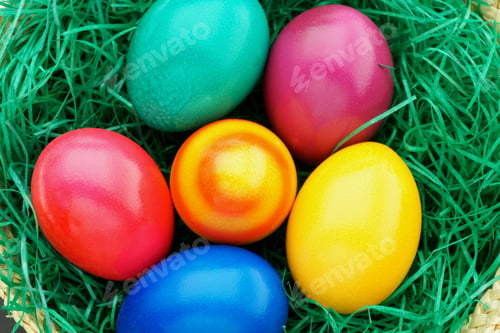 Preview: Colorful easter eggs in a nest from above