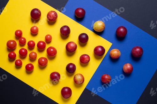 Preview: Creative of colorful tomato and cucumber, Creative foods. Black and yellow background for design