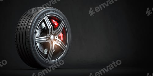 Preview: Car wheel. Disk with tyre and brakes on black background.
