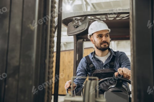 Preview: Warehouse worker driving forklift in modular building industry