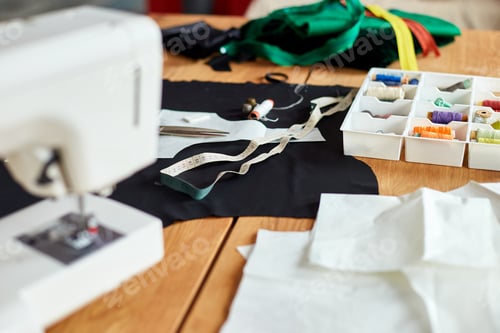 Preview: Sewing supplies and machine on a wooden table
