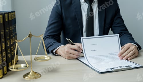 Preview: Lawyer hand holding pen and providing legal consult business dispute service at the office