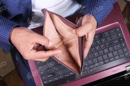 Preview: debt concept with Man hand open an empty wallet with copy space.