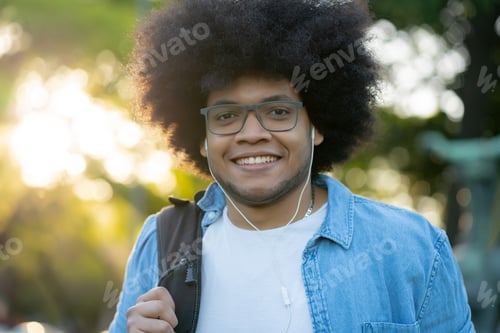 Preview: Portrait of young latin man outdoors.