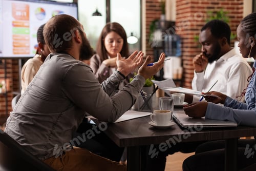 Preview: Multi-ethnic businessteam developing marketing project