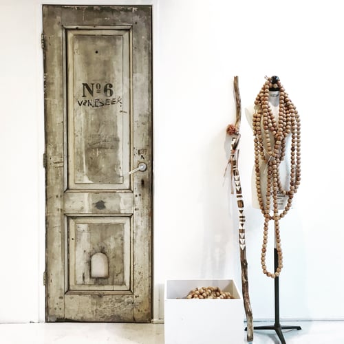 Preview: Rustic Doorway Display with Wooden Beads and Mannequin