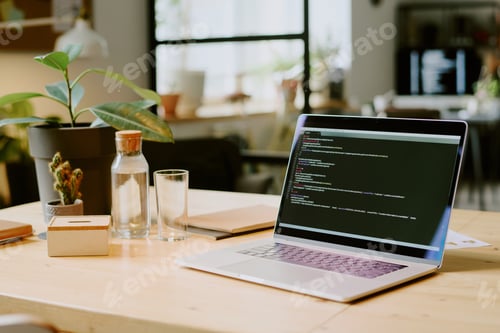 Preview: Laptop With Code On Screen In Office