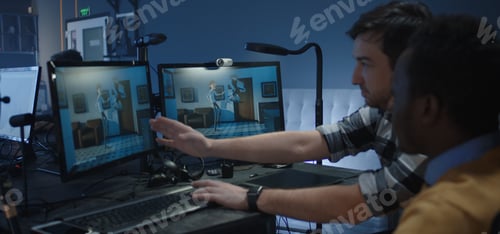 Preview: Medium Shot Of Two Digital Artists Discussing About The Details Of An Animated Film