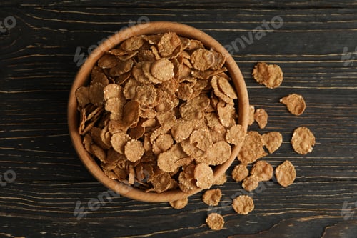 Preview: Bowl of tasty muesli on wooden background