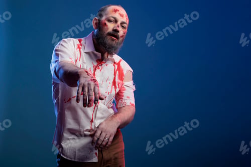 Preview: Halloween cruel zombie with bloody wounds