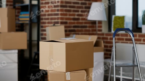 Preview: Stacks of cardboard boxes in empty real estate property