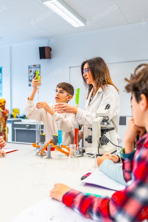 Preview: Students and teacher performing chemistry experiment in school laboratory