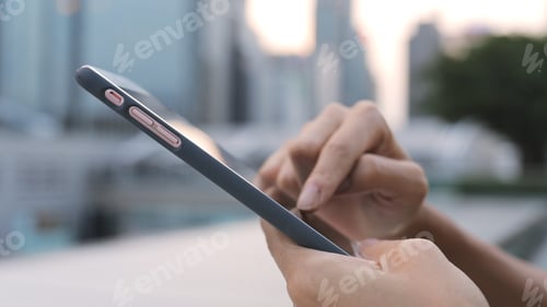 Preview: Working on cellphone in the evening