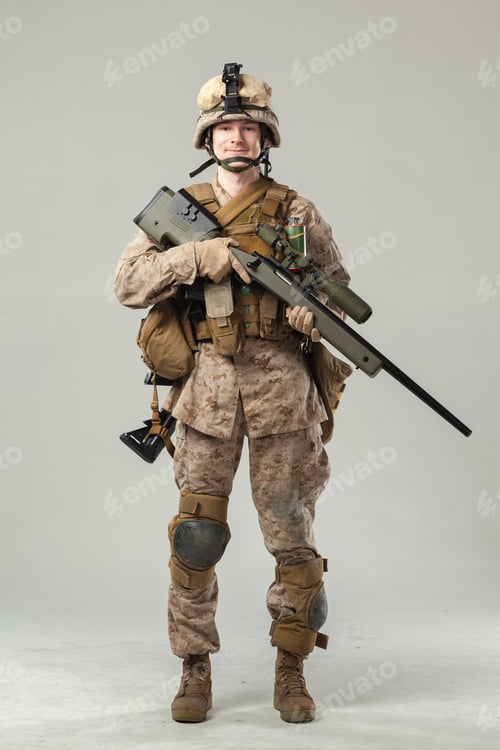 Preview: Soldier stands with a rifle in a neutral space during training session