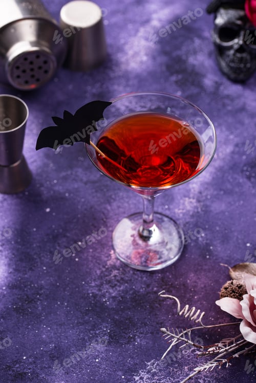 Preview: Halloween martini cocktail on purple background