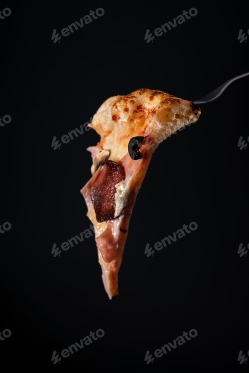 Preview: Vertical shot of a piece of pizza on a fork on a black background