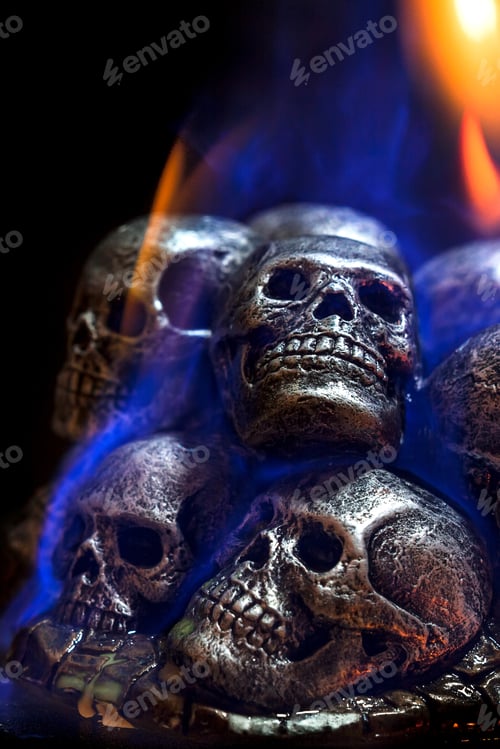 Preview: Burning skulls on black background