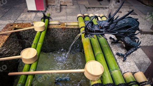 Preview: Purification by washing hand at fountain of sanctuary in Japan shinto temple