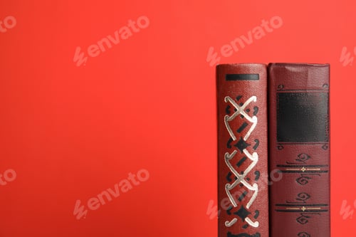 Preview: Old books on red background, space for text