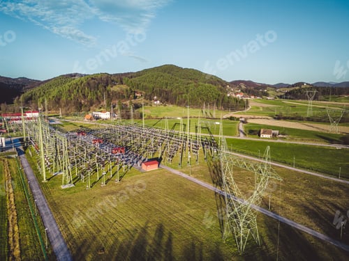 Preview: Aerial view of electrical power station in the country side of Slovenia on a sunny day