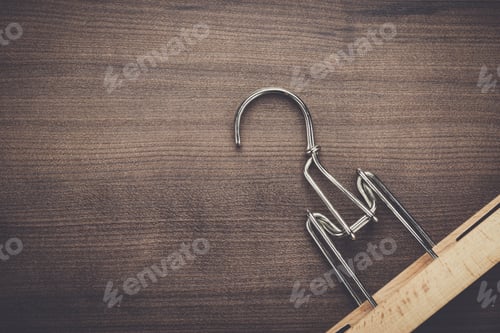 Preview: Wooden Hanger on a Dark Wooden Background