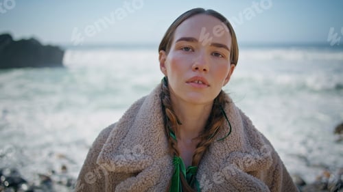Preview: Portrait calm woman posing sunny shore. Fashion model with braids resting ocean