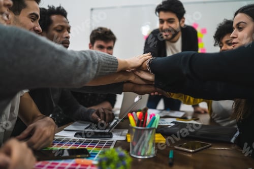 Preview: Team of work showing unity with their hand together.