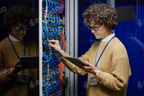 Preview: IT engineer checking the work of internet cables