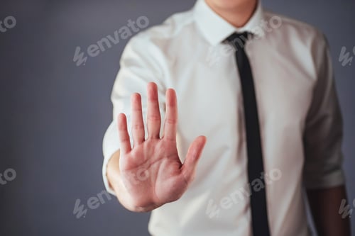 Preview: Young businessman in a suit shows his hand