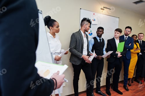 Preview: Multiracial young creative people in modern office