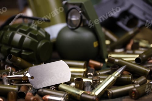 Preview: Different types of ammunition on a camouflage background. Preparing for war