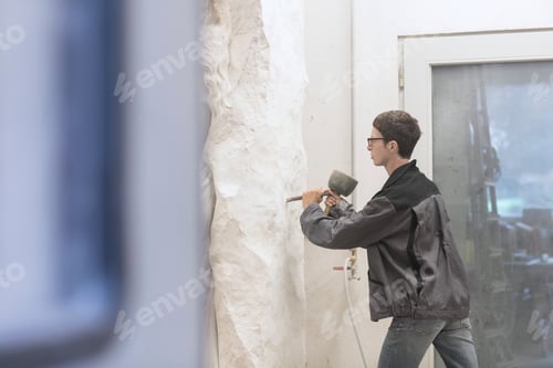 Preview: Stonemason using chisel and mallet to create sculpture