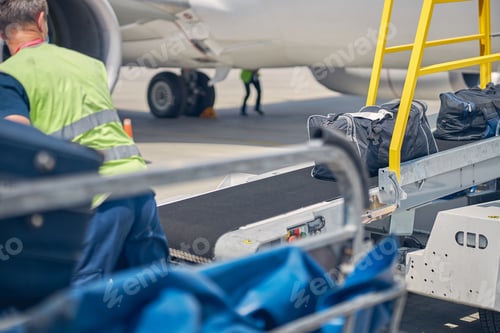 Preview: Airport male worker looking at the baggage