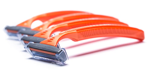 Preview: Orange razors for shaving over white background
