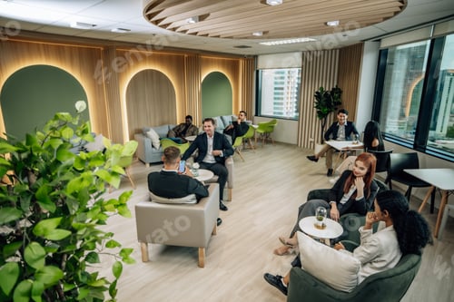 Preview: Diverse businesspeople collaborate at cozy conference, exchanging ideas and partnerships for growth