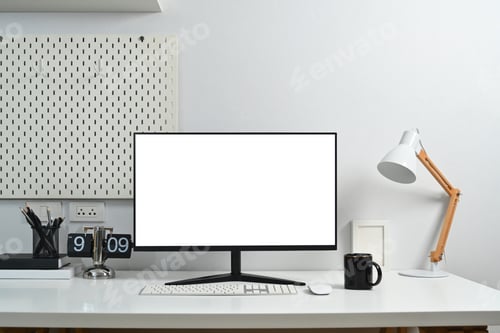 Preview: Modern workplace with blank computer monitor, coffee cup, lamp and peg board on wall