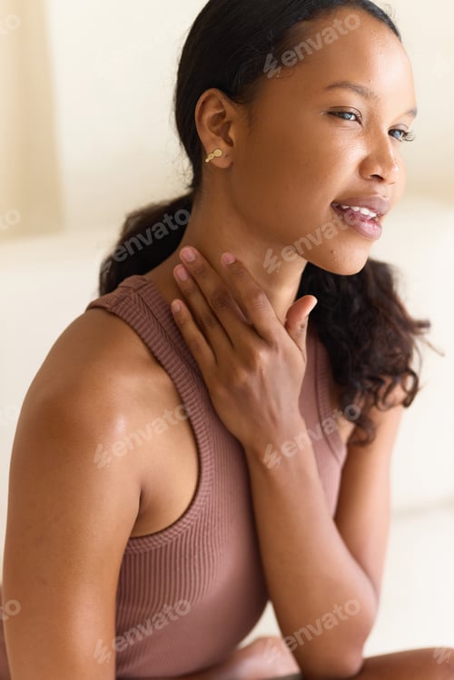 Preview: Neck Care. Young Woman Enjoying Her Skin Care Ritual in Natural Light