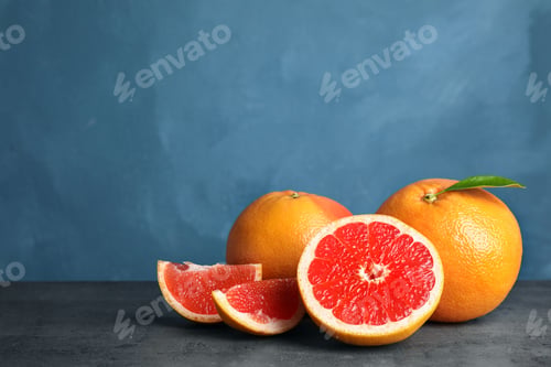 Preview: Fresh tasty grapefruits on table. Space for text