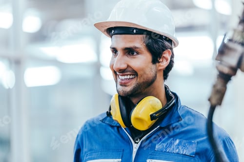 Preview: Portrait of smiling male factory worker at construction industry