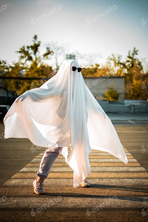 Preview: Celebrating halloween. Ghost Challenge 2021. Spooky trend season. A man dressed as a ghost from a sh