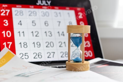 Preview: Time passing concept, time slipping away. Hourglass and the calendar