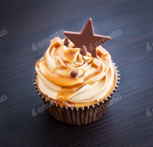 Preview: Delicious Caramel Cupcake with Star on Wooden Table