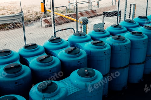 Preview: Large, blue plastic containers for industrial storage of water and other liquids.