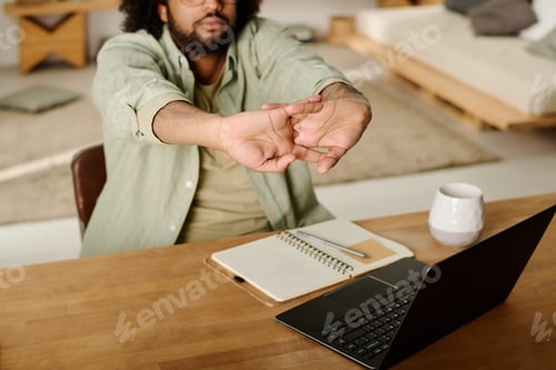 Preview: Guy stretching arms with clasped fingers